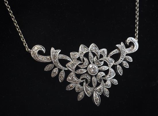 A white gold and diamond cluster pendant necklace, 13in.